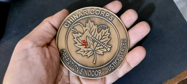 Chinar Corps coin reverse with maple leaf and Operation Sindoor Justice Served, held in hand