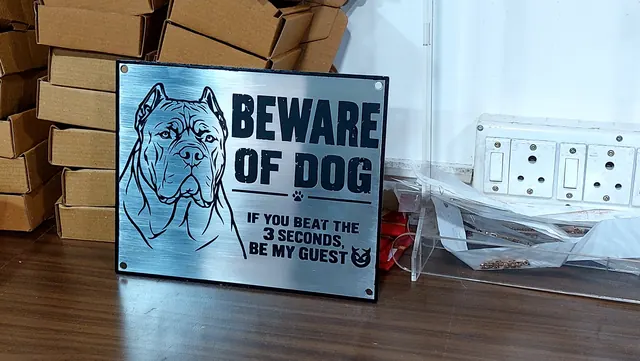 Laser-engraved stainless steel Beware of Dog sign with dog portrait