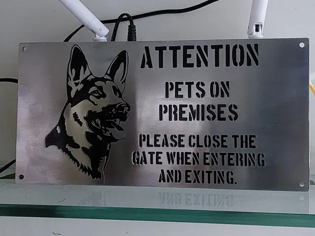 Stainless steel sign with dog portrait and cut lettering